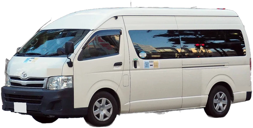 A white Toyota HiAce high-roof passenger van