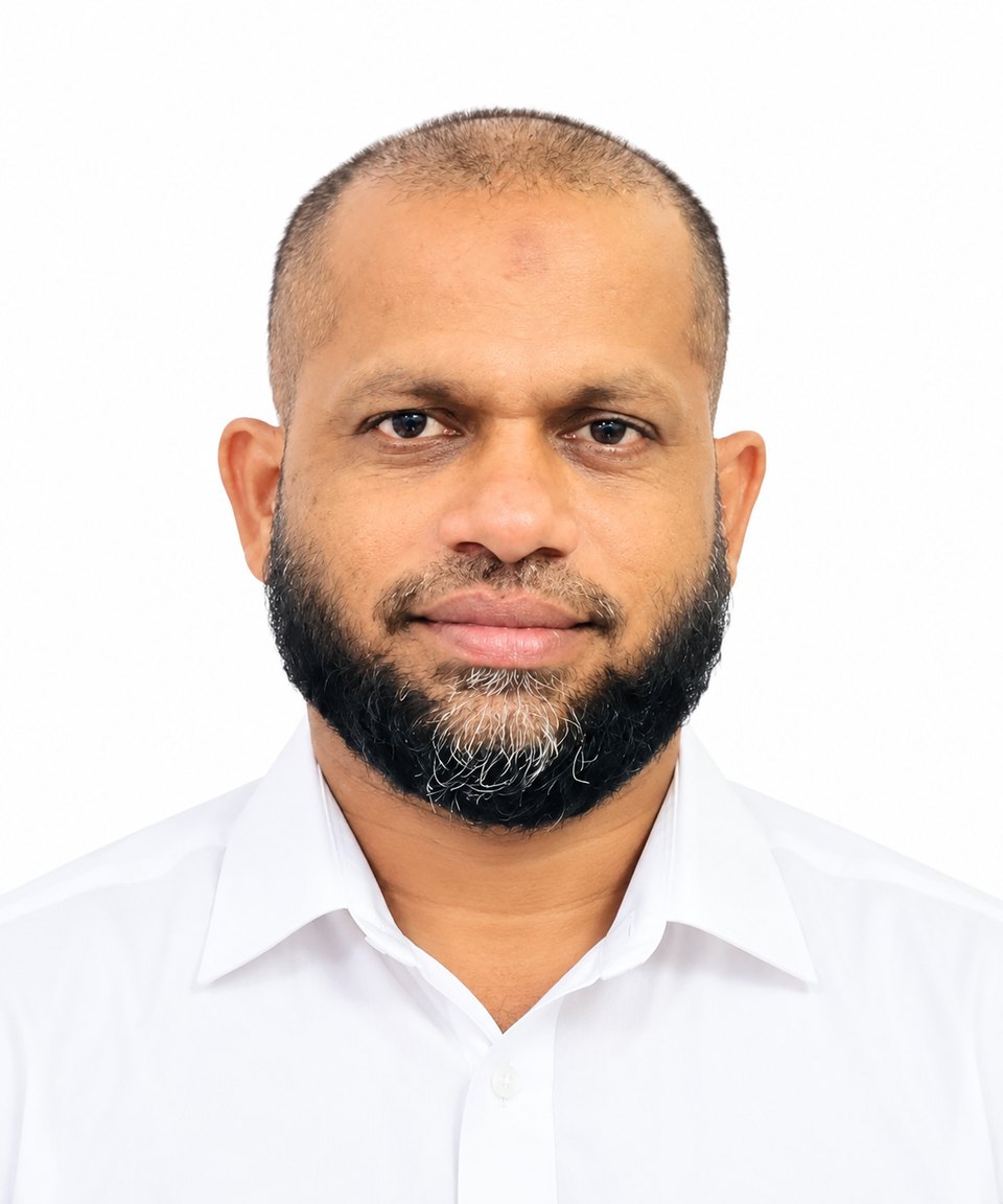 Portrait of M.S. Mohamed Asmeer in a white shirt